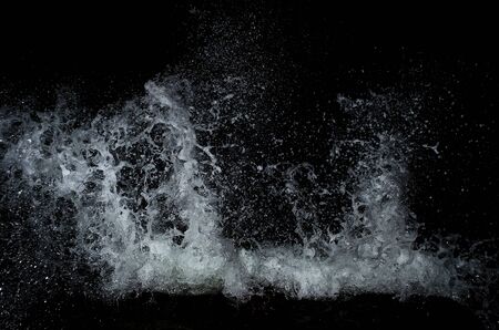Splashing wave on the Black sea in the night.の写真素材