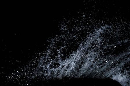 Splashing wave on the Black sea in the night.の写真素材