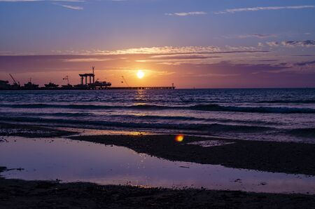 Marina and ships against the background of sunset and seagulls. Black Seaの写真素材
