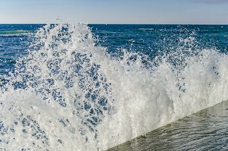Splashing wave on the Black sea in the sunny day.の写真素材