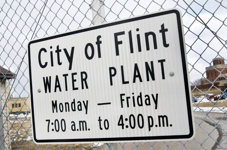 City of Flint Water Plant Sign on Chain Link Fenceの写真素材