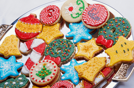 Artistically Decorated Christmas Cut-Out Cookies On Silver Trayの写真素材