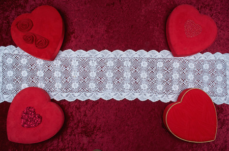 Valentine Background,Four Valentine Hearts in Corners, Lace Runner on Red Crushed Velvetの写真素材