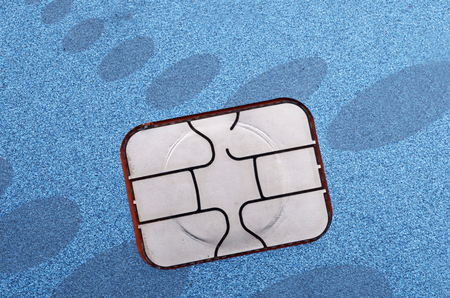 EMV Electronic Circuit Chip on Blue Credit Cardの写真素材