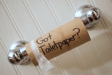 Toilet Paper Empty cardboard toilet paper roll on spool readingの写真素材