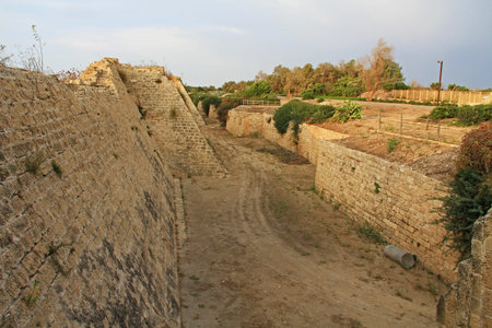Ruins of fortress and moat in Caesarea Maritima National Park, a city and harbor built by Herod the...