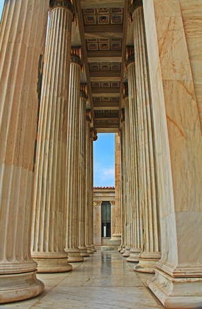 The tall columns on the entrance porch of the National Academy of Arts in Athens, Greece.の写真素材