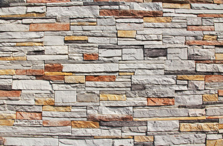 Multi-colored Red, yellow, orange and white colorful stone wall background Texture in Kusadasi,...