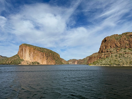 View from a steamboat, of Canyon Lake reservoir, Mormon Flat Dam and rock formations in Maricopa County, Arizona in the Superstition Wilderness of Tonto National Forest formed fromの写真素材