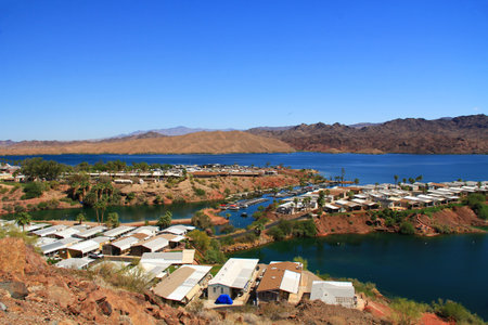 View of Lake Havasu and Colorado River with homes and harbor near Lake Havasu City, Arizona, USA with view of California and blue sky copy space.の写真素材