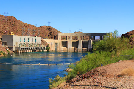 Hydroelectric Power Parker Dam beside transmission towers on the Colorado River and Lake Havasu, in Arizona, USA with blue sky copy space.の写真素材