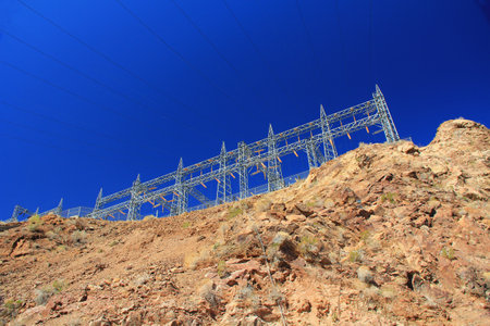 Hydroelectric Power transmission structures in California at Arizonaâs Parker Dam on the Colorado River, USA with blue sky copy space.の写真素材
