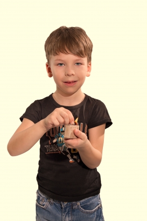 mischievous boy in the studio playing with fire and matchesの写真素材