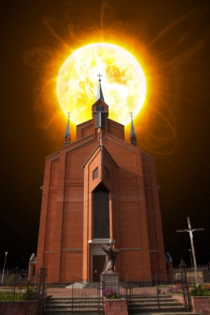 the sun shines over the Catholic church. possible end of the world. Armageddonの写真素材