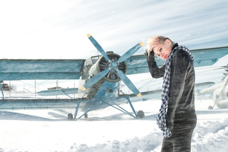 sexy young girl next to the pilot vintage aircraftの写真素材