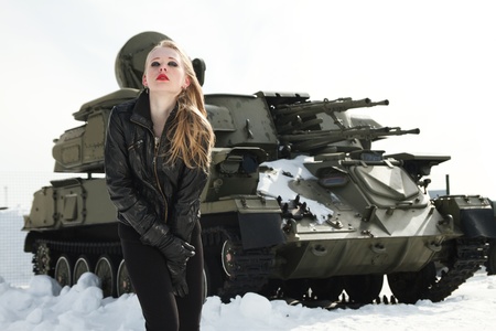 Sexy erotic blonde against antiaircraftの写真素材