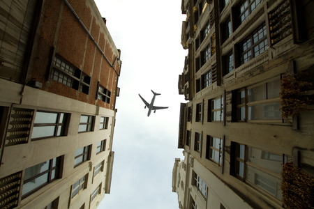 plane over the city of Brussels tilt - shift の写真素材