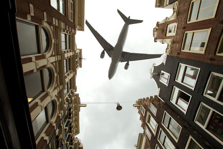 plane over Amsterdamの写真素材