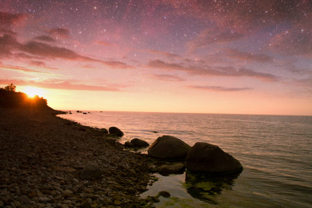 sunset at sea. variety of colors and hues of the rising sun. Elements of this image furnished by NASAの写真素材
