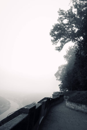 fortress KÃ¶nigstein. autumn fog and the mountain with the castle.の写真素材