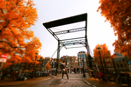 musician enjoys the view of Europe. Amsterdam autumn. beautiful places in Europeのeditorial素材