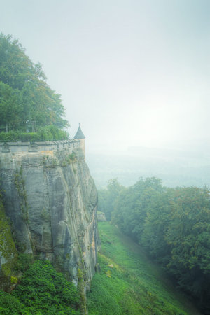 fortress KÃ¶nigstein. autumn fog and the mountain with the castle.のeditorial素材