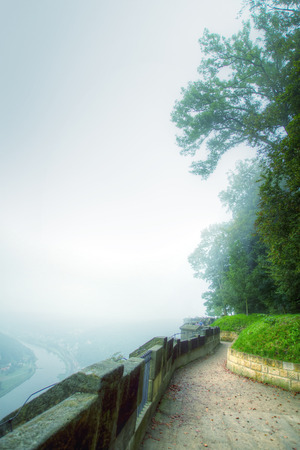 fortress KÃ¶nigstein. autumn fog and the mountain with the castle.のeditorial素材
