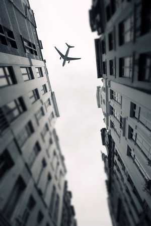 plane over the city of Brussels tilt - shiftの写真素材