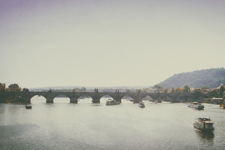 vintage retro style. Prague in the fall. Charles Bridge sunny dayの写真素材