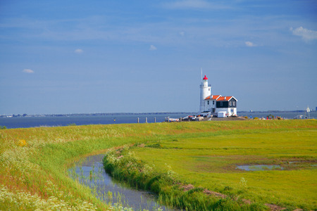 lighthouse in Marken is on the coast of the Sea in Europeの写真素材