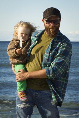 Dad and daughter at the sea . vacation by the oceanの写真素材
