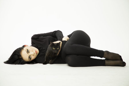 Women and cats. black and white photo. The hidden nature of women walking alone. a symbol of independence.  の写真素材