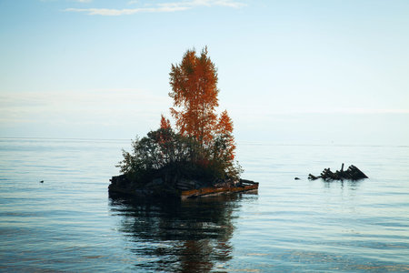Island on Lake Baikal in the autumn. The most beautiful and wonderful little seaの写真素材