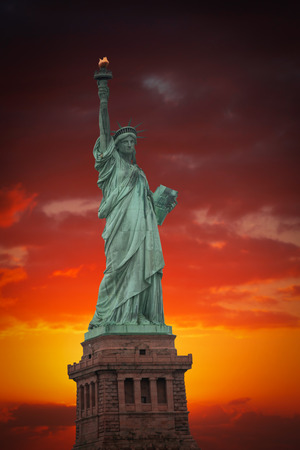 Statue of Liberty on the background of colorful dawn skyの写真素材