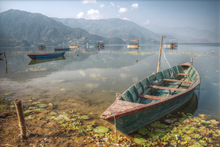Phewa Lake - the second largest lake in Nepal located in the Pokhara Valley near the town and the mountain Sarangkot.の写真素材