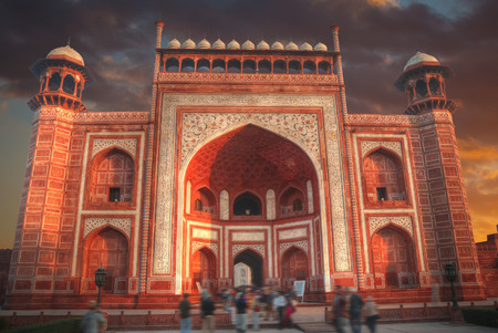gate through which the Taj Mahal visitors in a park that surrounds the mausoleumのeditorial素材