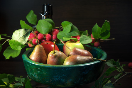still life of a pear and apples lying on a neutral backgroundの写真素材