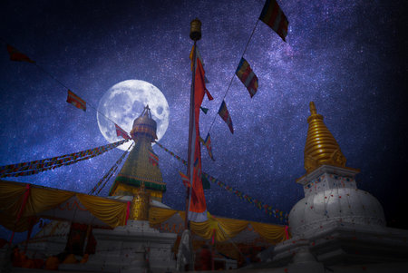 Swayambhunath Stupa stands on the hill in Kathmandu, Nepal. At night the moon and stars shine.の写真素材