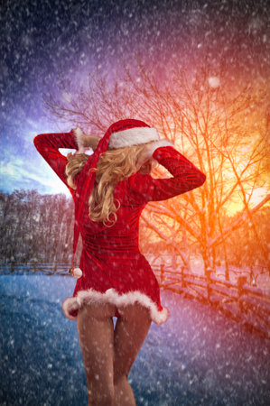 Snow is coming before Christmas. Sexy Santa before the new year.の写真素材