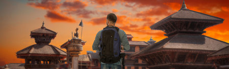 man traveler stands with a backpack on the background of Patan, Nepalの写真素材