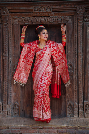 Bhaktapur, Nepal-November 19: A family dress of red color during a traditional wedding in Bhaktapur November 19, 2017.のeditorial素材