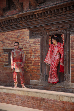 Bhaktapur, Nepal-November 19: A family dress of red color during a traditional wedding in Bhaktapur November 19, 2017.のeditorial素材