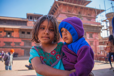 BHAKTAPUR, NEPAL - DECEMBER 14, 2017: Two children in Durbar Square, Kathmanduのeditorial素材