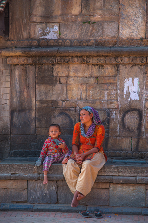 BHAKTAPUR, NEPAL - JANUARY 8, 2010: Portrait of Nepalese girl playing at Durbar squareのeditorial素材