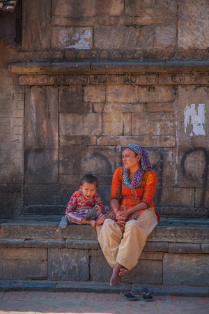 BHAKTAPUR, NEPAL - JANUARY 8, 2010: Portrait of Nepalese girl playing at Durbar squareのeditorial素材