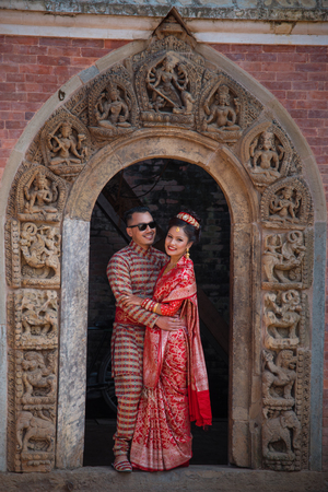 Bhaktapur, Nepal-November 19: A family dress of red color during a traditional wedding in Bhaktapur November 19, 2017.のeditorial素材