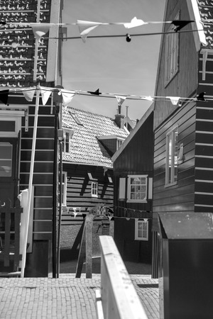 black and white photography. Traditional houses in Holland town Volendam, Netherlandsのeditorial素材