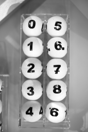 white balls with numbers for the game of lottery.の写真素材