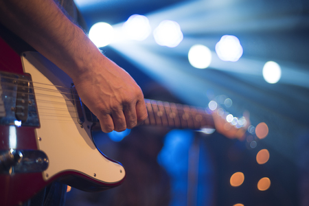 The artist plays the guitar. Rock band at a concertの写真素材