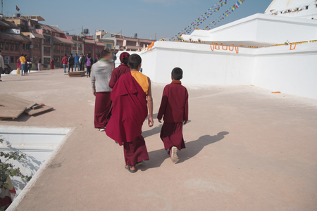 He walks the streets of Kathmandu a lot of people selling goods on the streetのeditorial素材
